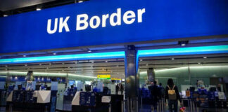 UK border entry with barriers and signs