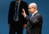 The Trump-Netanyahu Rift Draws New Attention I dont know who this person is waving