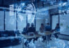 Business team in conference room with digital data overlays