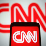 CNN logo displayed on phone and screen.