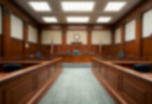 A Court Ruling Ignites Free Speech Debate Blurred view of a courtroom with wooden furnishings
