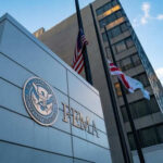 FEMA building with flags outside and blue sky