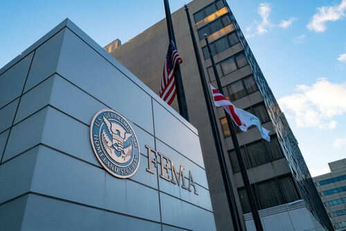 FEMA building with flags outside and blue sky