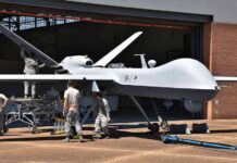 The Air Force’s New Wingmen Take Flight Military drone being serviced by ground crew outside a hangar