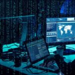 cybersecurity analysts at workstations with code and world map on screens