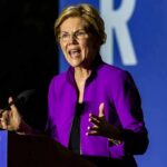 Democrats Press Trump Library Over Missing Millions Person speaking at a podium in a purple jacket