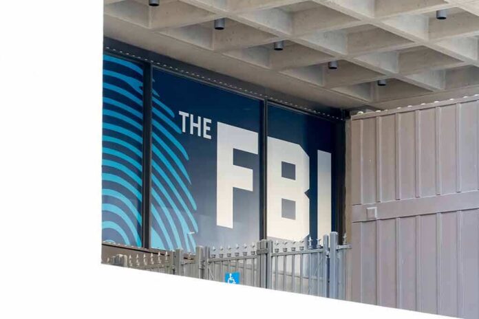 FBI sign on building facade behind metal fence