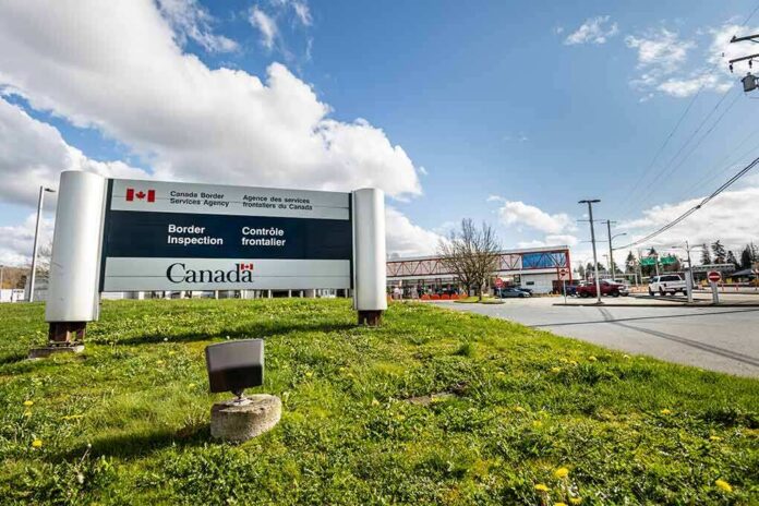 shutterstock_1689376294 Canada border inspection sign at roadside checkpoint
