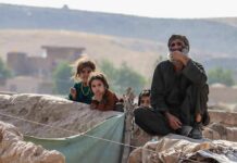 Climate Or Culture? ABC Sparks Fresh Debat Group of people sitting by a low earthen wall