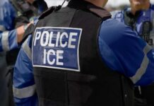 One Fatal Encounter Leaves Unanswered Questions Close-up of a police officer's vest with 'POLICE ICE' label