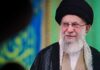 Iran’s Biggest Display Raises New Questions A religious leader speaking in traditional attire against a colorful background