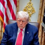 New Iran Threat Report Grabs Washington’s Attention Donald Trump seated in the Oval Office with a serious expression