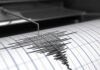 One Massive Quake. A Very Different Ending. Seismograph needle recording earthquake waves on paper