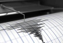 One Massive Quake. A Very Different Ending. Seismograph needle recording earthquake waves on paper