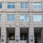 US Immigration and Customs Enforcement building entrance flags