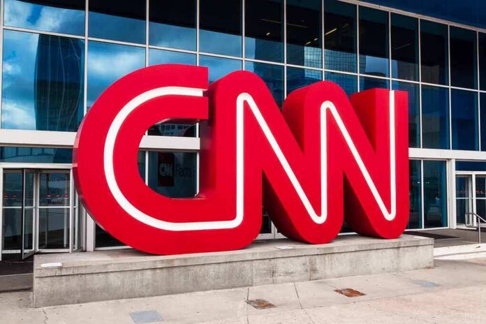 shutterstock_1032509656 CNN red logo sculpture outside a modern glass building