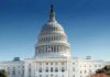 United States Capitol building with dome under clear blue sky