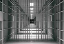 Trail Attack Stuns City — Then More Allegations empty prison corridor with barred cells