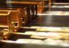 Sanctuary Stunt Explodes In Senate Race Wooden church pews with stained glass light on the aisle