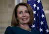 Pelosi’s Latest Stock Disclosure Raises Eyebrows smiling woman in front of a U.S. flag
