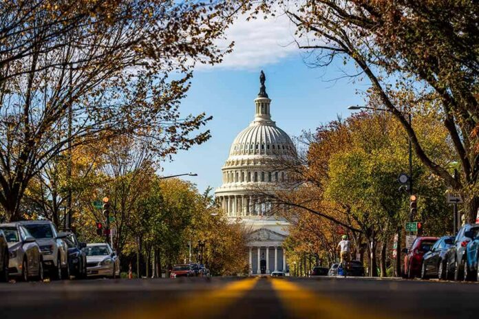 United States Capitol dome framed by a tree-lined street
