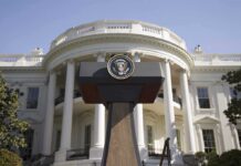 Behind The Toasts, A Much Bigger Game Press podium with presidential seal in front of the White House