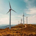 Ugly Towers, Higher Bills — Then This Wind turbines on a sunny hillside