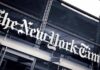 The New York Times sign on a glass building facade
