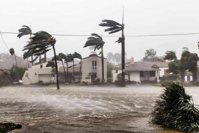 Houses battered by hurricane winds and flooding