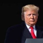 Trump Vows Instant Iran Win — Aides Balk Donald Trump at a podium with a microphone