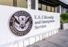 USCIS sign at a federal building entrance