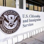 Border Release Backfires—Sacramento Horror USCIS sign at a federal building entrance