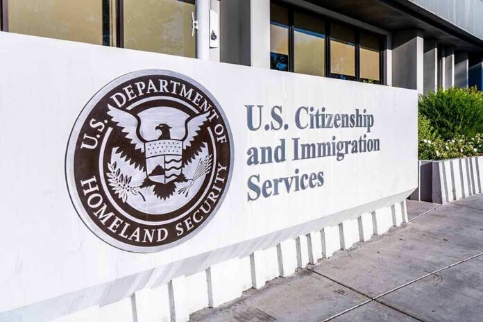USCIS sign at a federal building entrance