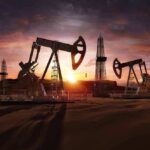 Russia’s Oil Just Got Much Pricier For China Oil pumpjacks and derricks at sunset in a desert field