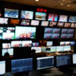 control room with multiple screens and monitors