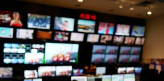 control room with multiple screens and monitors