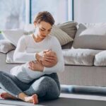 Free Childcare? Wait Until You See the Tab Mother breastfeeding baby on living room floor