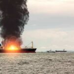 One Tanker Tested America’s Naval Blockade Cargo ship on fire with thick black smoke at sea