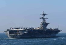 Aircraft carrier cruising at sea