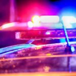 Police car light bar flashing at night