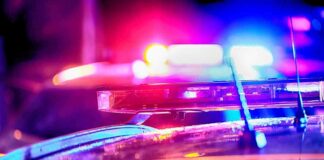 Police car light bar flashing at night