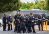 Group of police officers standing in a parking lot