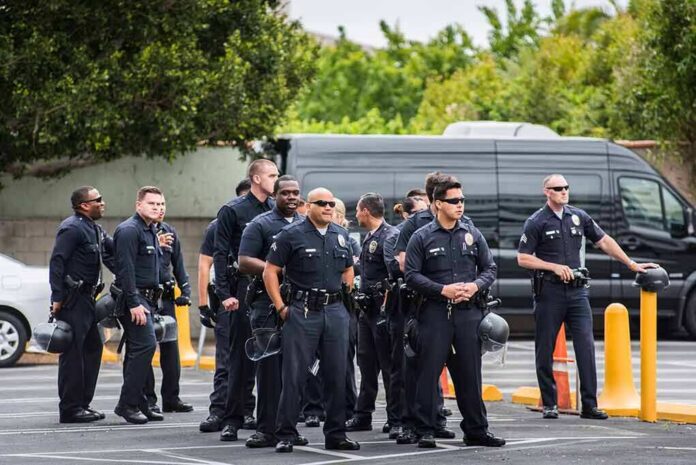 Group of police officers standing in a parking lot