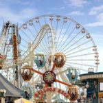 A Boardwalk Ride Turns Terrifying In Seconds Colorful amusement park scene featuring a ferris wheel and carousel