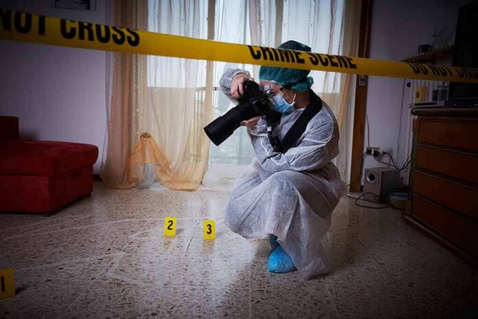 shutterstock_728429896 forensic photographer documenting indoor crime scene