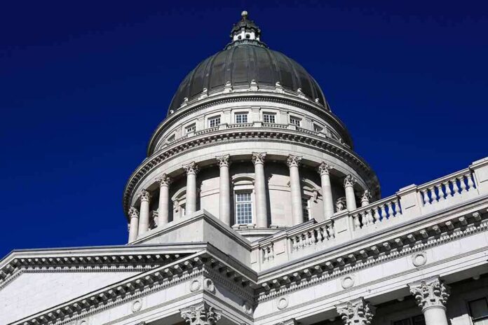 Capitol building dome with columns against a deep blue sky