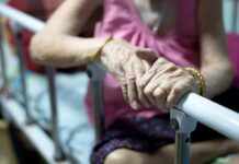 Outrage: Faith vs. Forced Death Allegation Elderly person’s hands resting on a hospital bed rail