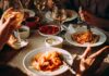 GLP-1 Wave Reshapes Fast Food Pasta dinner with wine on a sunlit table