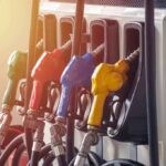 Fuel pump nozzles in multiple colors at a gas station