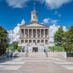 Neoclassical capitol building with central tower and steps